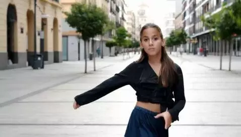 AI Video from prompt: Girl is posing on a camera.