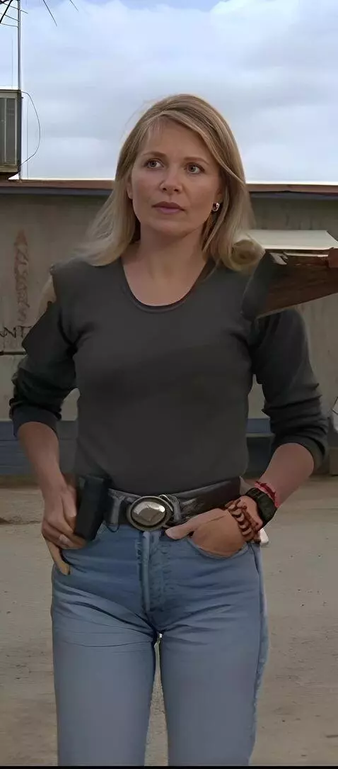 AI Video from prompt: She is standing in a swimsuit on the beach