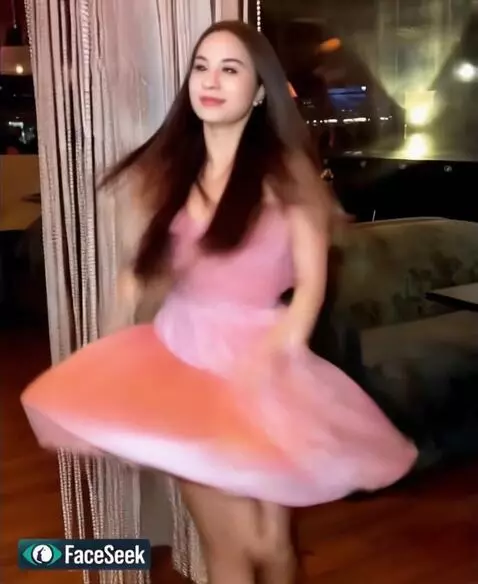 AI Video from prompt: The girl playfully dancing - she pj in night clu