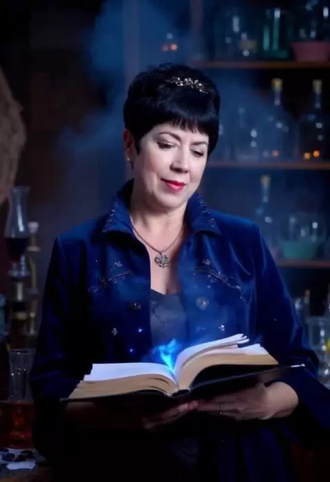 AI Video from prompt: The sorceress works in her magic library, add fo