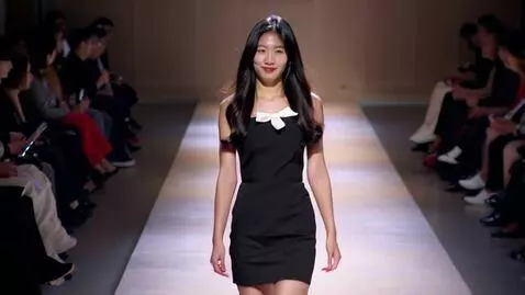 AI Video from prompt: A beautiful Korean woman (she is young) walks do