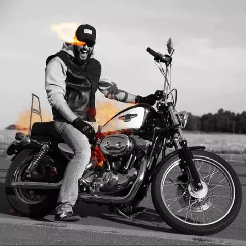 AI Video from prompt: едет на горящем в огне мотоцикле, смейся и глаза