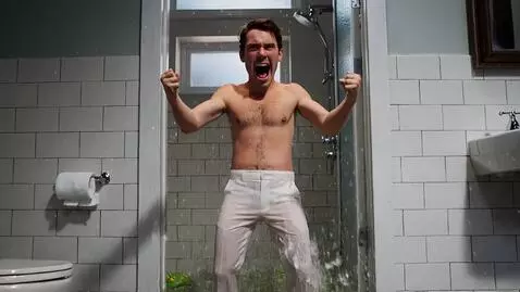 AI Video from prompt: a man is smiming in his flooded bathroom when 10