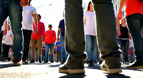 AI Video from prompt: Scene: A crowded street corner erupts with rhyth