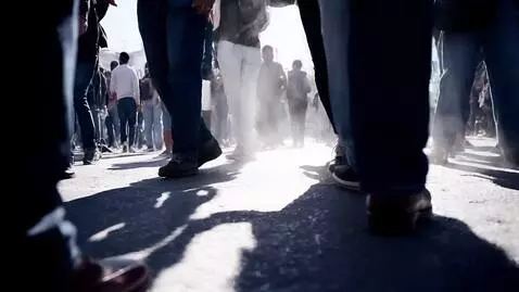 AI Video from prompt: Scene: A crowded street corner erupts with rhyth