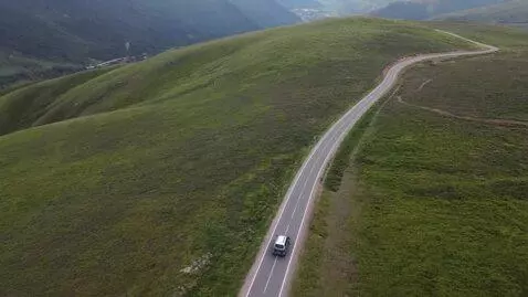 AI Video from prompt: a car driving on a mountain
