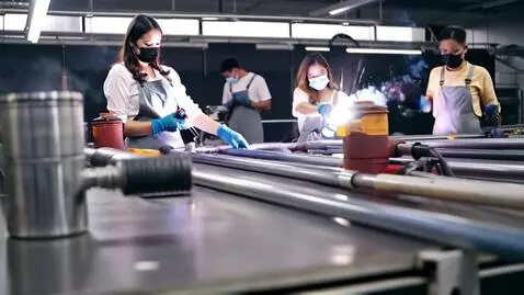 AI Video from prompt: Scene and action: Professional welders in protec