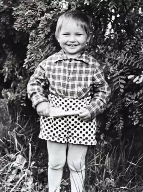 AI Video from prompt: The boy smiles slightly and jumps up and down. B