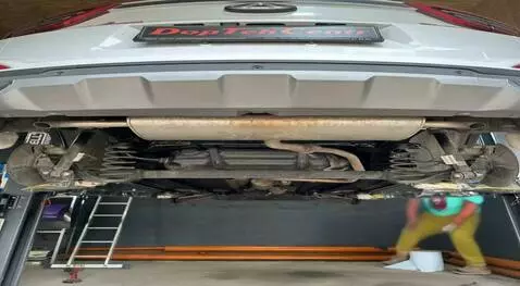 AI Video from prompt: Grandma, against the background of a car that is