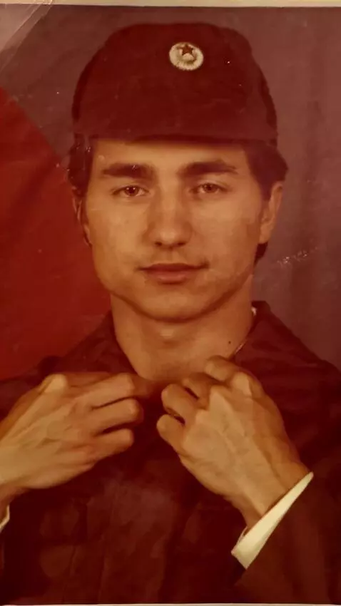 AI Video from prompt: The man looks into the camera and tilts his head