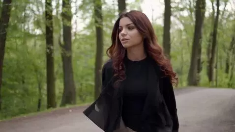 AI Video from prompt: the girl her name is Natalya she is walking thou