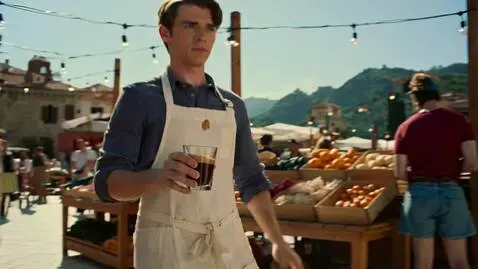 AI Video from prompt: A barista in a white apron runs through a market