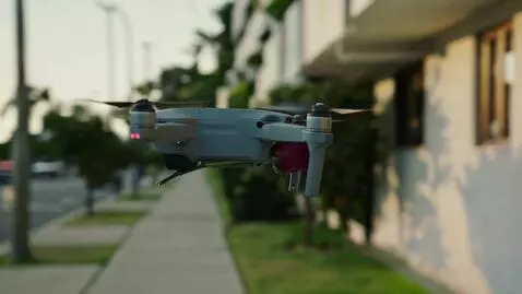AI Video from prompt: A guy in a leather jacket is flying a drone carr
