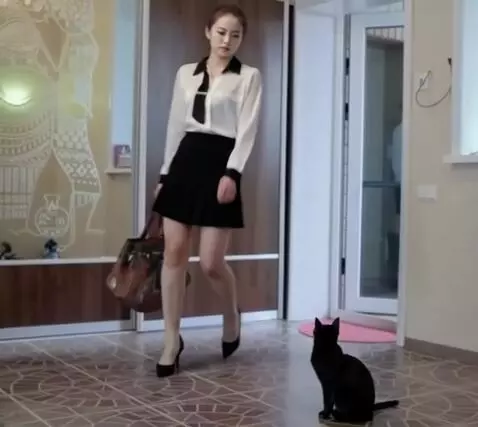 AI Video from prompt: The girl comes closer and bends down