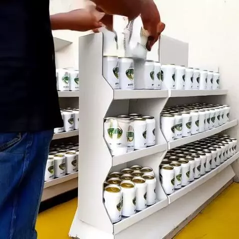 AI Video from prompt: a person puts brandless white  cans to the shelv