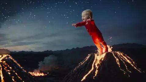 AI Video from prompt: baby bouncing from one melon-shaped volcano to a