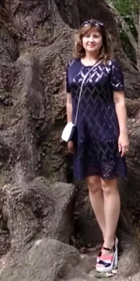 AI Video from prompt: woman walk from tree and smile