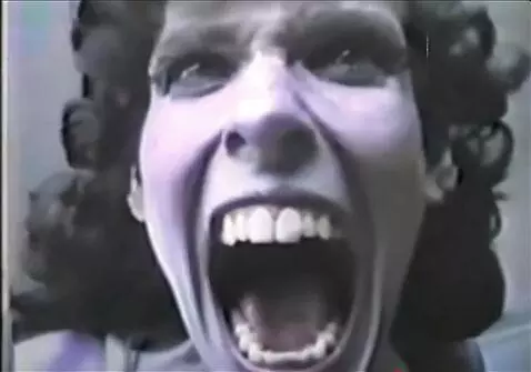 AI Video from prompt: A person starts to laught and screaming, horror