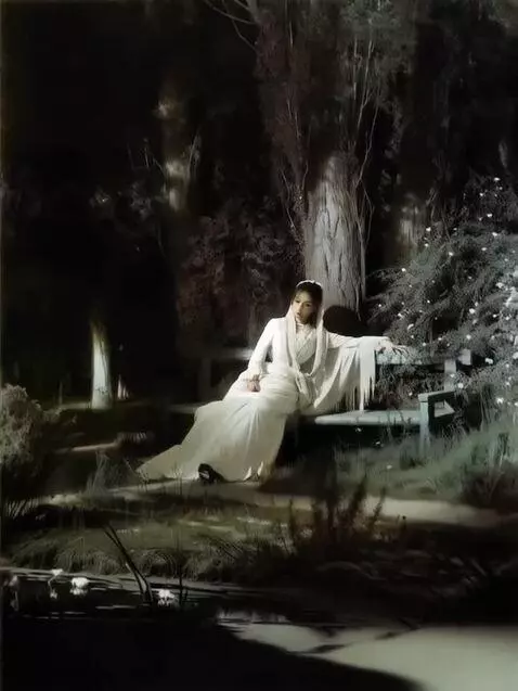 AI Video from prompt: A girl is relaxing on a bench on a moonlit night