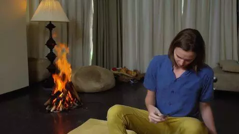 AI Video from prompt: Gena Barboskin sit on coach and fire beging to c