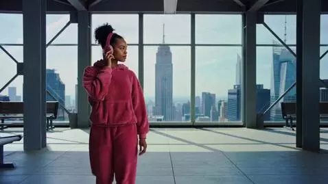 AI Video from prompt: Pretty black girl with A slick high curly bun in