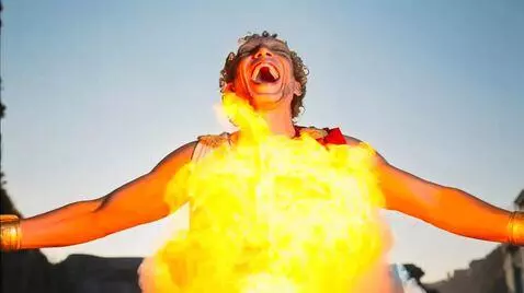 AI Video from prompt: The man laughs loudly. In front of him blows up 