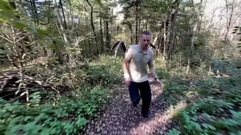 AI Video from prompt: a man runs away from a giant spider, and the spi