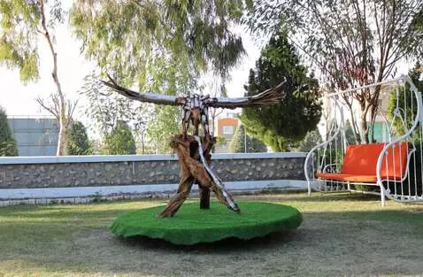 AI Video from prompt: eagle statue lands from sky on wood stage and on