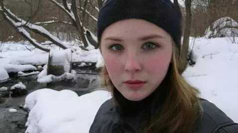 AI Video from prompt: A pretty young Russian woman looks fearfully at 
