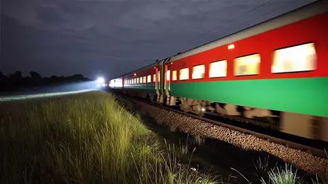 AI Video from prompt: A train with a red and green color scheme, featu