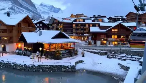 AI Video from prompt: A picturesque winter village nestled at the foot