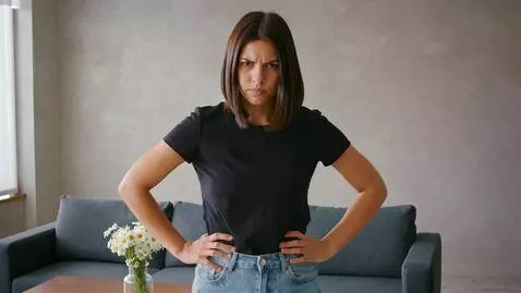 AI Video from prompt: 20 year old woman placing her hands on her hips 