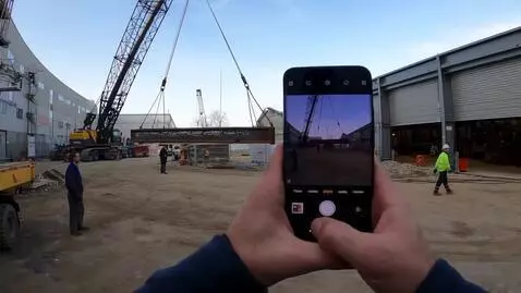 AI Video from prompt: A realistic video of a 1500-ton mobile crane wor