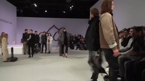 AI Video from prompt: Mario Leccese is walking on the catwalk at Dolce