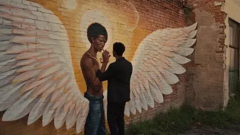 AI Video from prompt: EXT. DETROIT ALLEY – GOLDEN HOUR. An African Ame