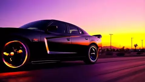 AI Video from prompt: A midnight-black 2025 Dodge Charger explodes int