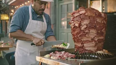 AI Video from prompt: A bustling Mexican street corner with a rotating