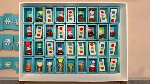 AI Video from prompt: Toys appear in empty boxes one by one in turn, s