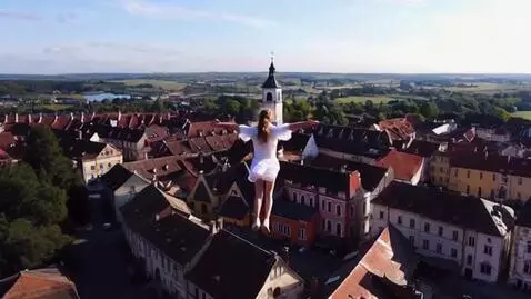 AI Video from prompt: Flying girl under old town