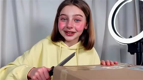 AI Video from prompt: YouTube vlog in an "unboxing" style. A cute and 