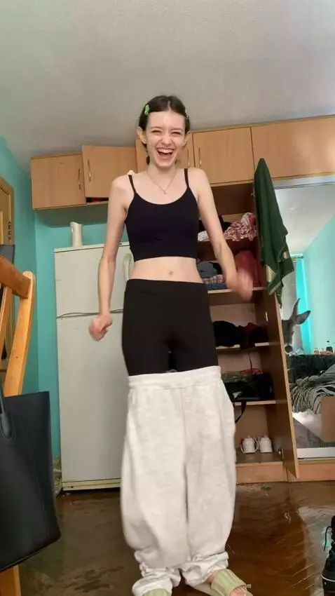 AI Video from prompt: A girl is tap dancing and laughing. Suddenly, a 