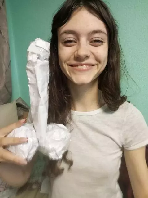 AI Video from prompt: The girl smiles as she is presented with an awar