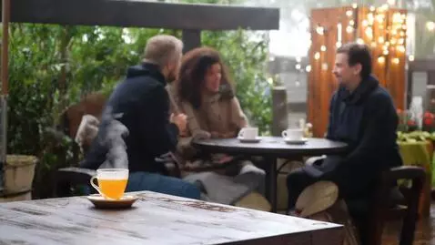 AI Video from prompt: A cozy coffee shop on a rainy day with steam ris