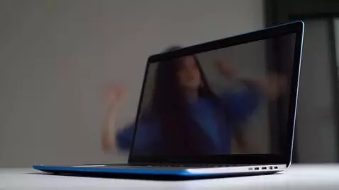 AI Video from prompt: {   "scene_title": "Laptop Dance & Transformatio