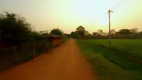 AI Video from prompt: A cinematic journey through a tranquil, rural vi