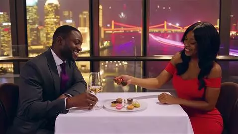 AI Video from prompt: A stunning Black couple enjoys a romantic evenin