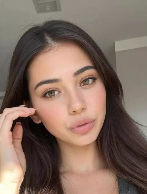 AI Video from prompt: playing with hair. tilting head