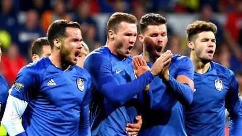 AI Video from prompt: football fans are chanting the name of a goalkee