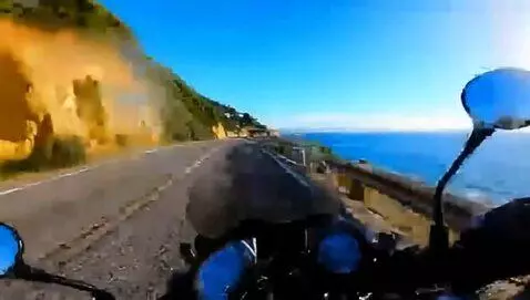 AI Video from prompt: POV of someone riding a motorcycle on a winding 