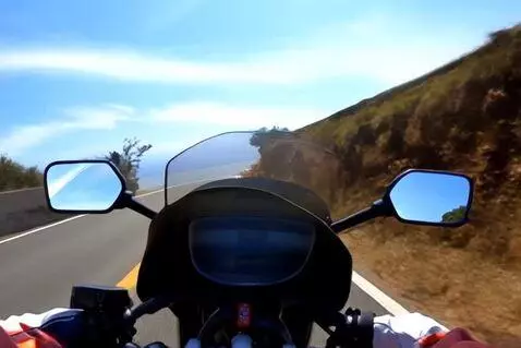 AI Video from prompt: POV of someone riding a motorcycle on a winding 